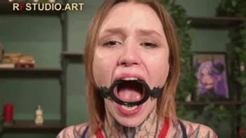 Astrid - Chair Bondage on the Turntable with Huge Ring Gag (FULL HD MP4).webp