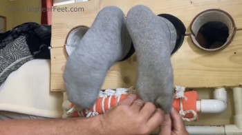 Itchy Big Feet - tickling big wide feet with itching powder in the socks.webp