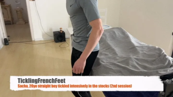 Sacha, 20 yo, 2nd session - intensively tickled in the stocks (Full HD).webp