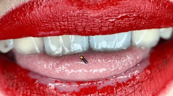 A small adventure of a tiny in the mouth of a giantess with red lips.webp
