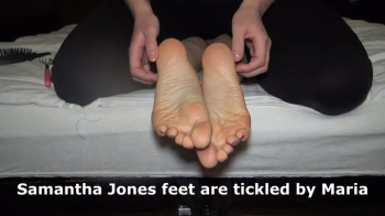 Samantha Jones feet are tickled by Maria.webp