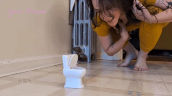 Giantess Bella Pees In A Tiny Toilet.webp