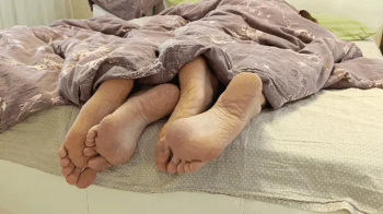 Flirting legs under the blanket f.webp