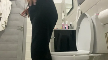 Hot blonde toilet sittingg and dumping.webp