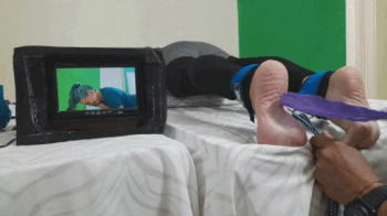 Agatha in face down soles tickling on tropical tv.webp