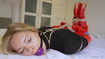 VERA HOGTIED AND BALLGAGGED IN RED THIGH BOOTS.webp