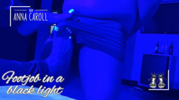 Foot fetish in a motel with black light.webp