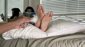 Ignoring Tickling While Reading.webp