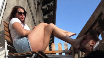 IRINA - Taking The Sun - DEVOTED Foot Worship And Footstool At The Balcony.webp