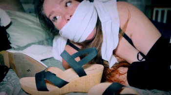 Mistaken Identity Leads To Celia Ray Spending A Night In Bondage (4K) - Celia Ray - multiple shoes, boots taped together.webp