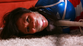 Gorgeous Taylor Summers ends up Tightly Toe Tied, Ball Tied, Sock gagged and Super Frustrated as- Captured America! RE E.webp