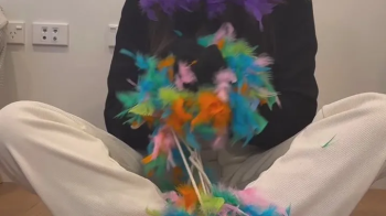 Erina in a cruel tickle punishment with Feather boa.webp
