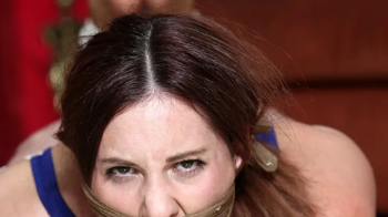 Pantyhose Clad Lilian ends up Tightly Hogtied, Triple Gagged, Groped & Humiliated by a Jilted Co-Worker! -RE EDIT 2025.webp