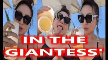 In The Giantess' Drink - Mz Kim Femdom Vore Giantess Asian Goddess Worship Divinity Belly Fetish Mouth Fetish Tongue Fet.webp