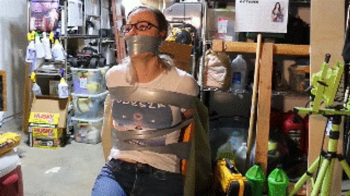 Cruelly taped up to a chair and wraparound tape gagged, Summer will spend the hours in a dark basement until she gets re.webp