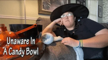 Unaware In Madisons Halloween Candy Bowl - HD 1080p Version - Trapped And Waiting To Be Eaten By An Unaware Giantess.webp