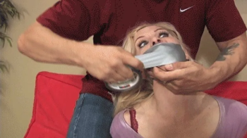 d2506EDEN-Busty Blond taped up and gagged tight.webp