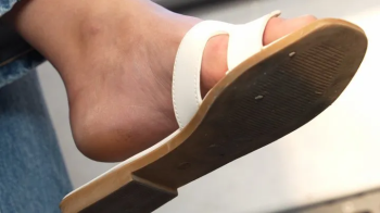 Foot and shoe fetish admiration, dirty feet and slippers dangling close-up, hot feet.webp