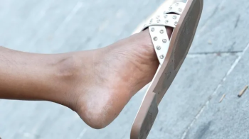 Unposing foot fetish close-up, candid slippers dangling, hot feet and soles.webp