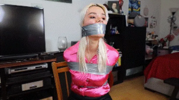 Angelica Coralvine tightly taped up and massively wraparound tape gagged with mouth stuffed, in a detective story advent.webp