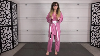 CHERRI EARNS HER YELLOW KARATE BELT.webp