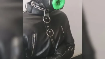 BDSM gay latex deepthroat training with gas mask and straitjacket.webp