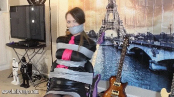 REMASTERED IN HD AND 60 FPS! Chrissy Marie is a music manager humiliated in bondage and wraparound tape gagged by the ar.webp