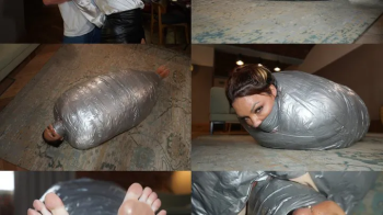 A thick duvet and duct tape mummification cocoon for rara curves (wmv).webp