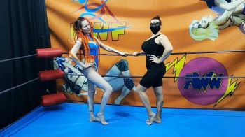 Strong fem wrestler vs skinny fem wrestler in a leotard.webp