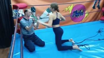 Strong brunette wrestles and ties up a guy.webp