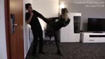 Lethal Blonde as Leather Cat Woman - Taking Down The Intruder.webp
