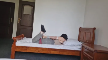 Allofbondage - Mily hogtied on bed.webp