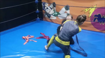 The Russian Amazons - Grappling girl ties up a skinny guy with martial art belts.webp