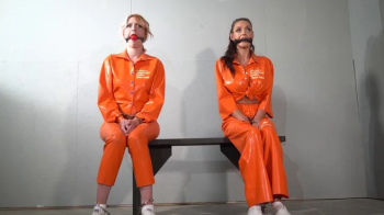 Altgirlsbound - 4161 Amber and Emma in Latex Prisoner Transfer.webp