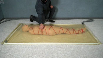 Vacuum Dreams - Mummification with bandages and rope bondage with ankle brace in a vacuum bed.webp