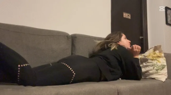Nipsandstrips - Muffled farts in yoga pants on couch.webp