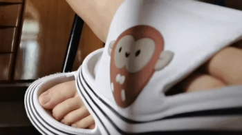 Nicoletta Embassi - Feet under the table in huge slippers - Extreme close up natural dirty feet 4K.webp